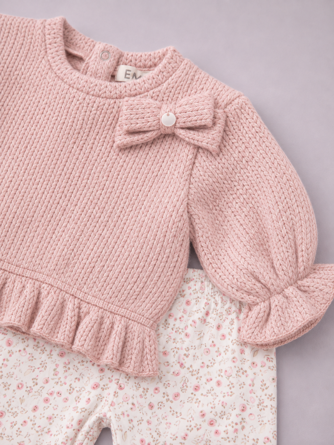 Completo Bimba Rosa in Maglia con Fiocco e Leggings Floreali